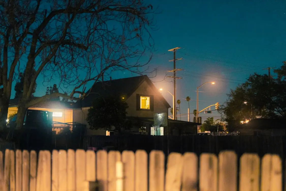 electricity illuminating a home at night.
