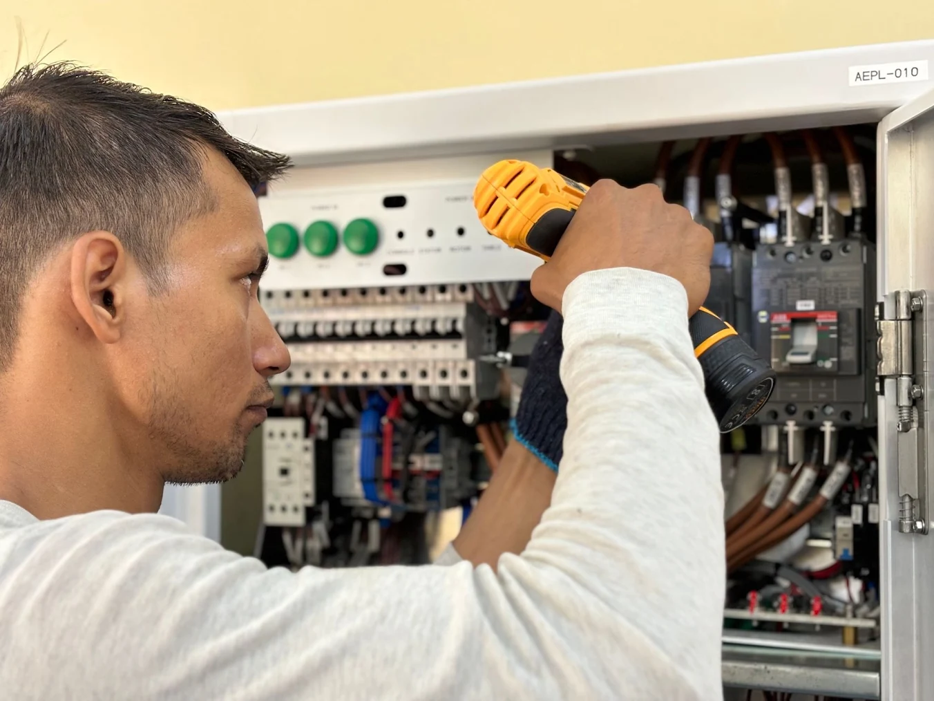 a technician working on electric wiring.